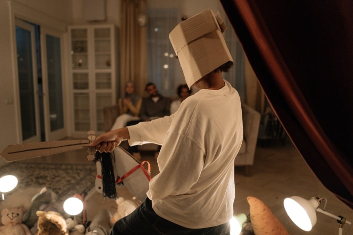 a man acting in front of his friends