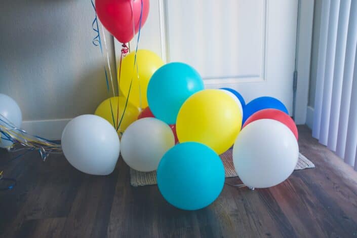 different colored balloons on the floor