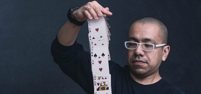 man playing with a deck of cards