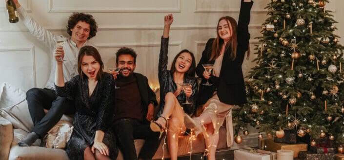 five people having fun and enjoying their drinks
