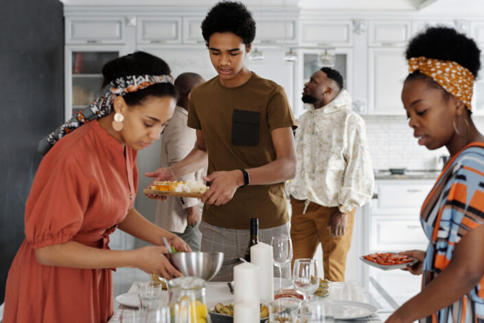 three people preparing food