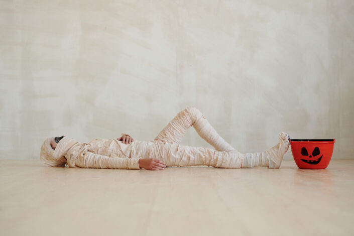 a person wearing a mummy halloween costume