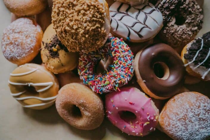 dozens of different flavored donuts