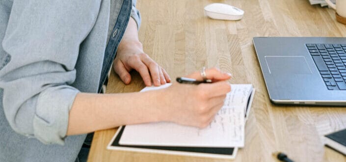 person writing notes