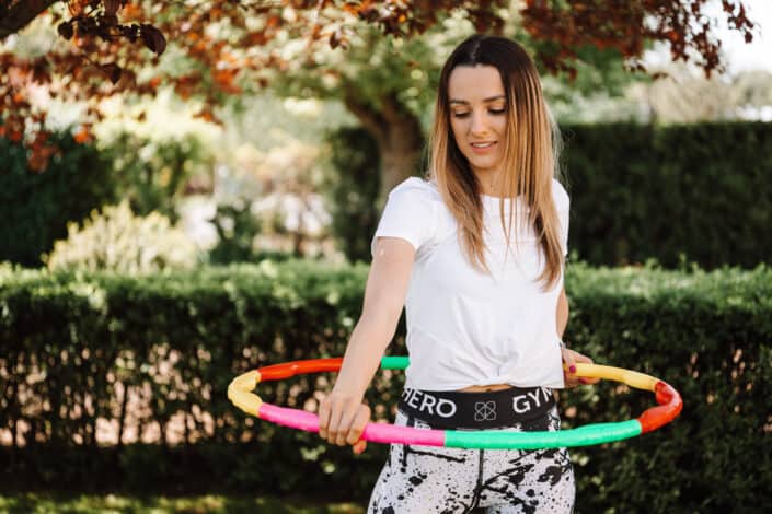 woman with a hoola hoop around her waist