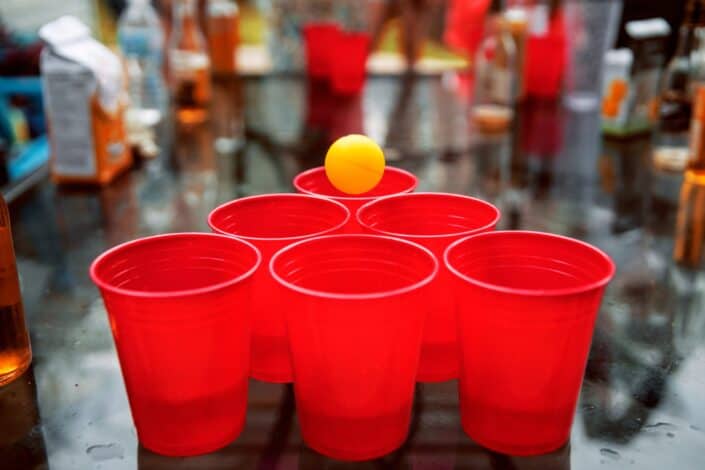 A ball that's about to shoot into a red cup