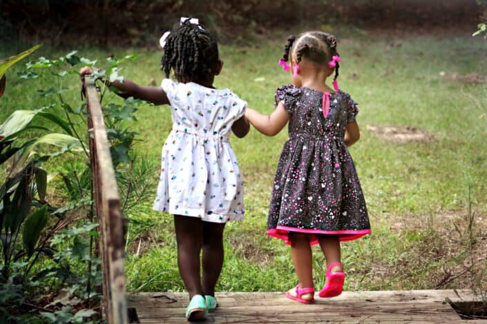two girls walking side by side