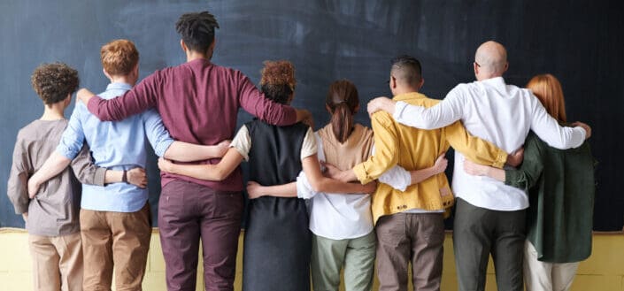 group of people holding each other