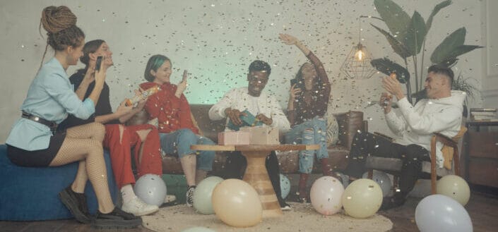 Friends having fun enjoying the confetti