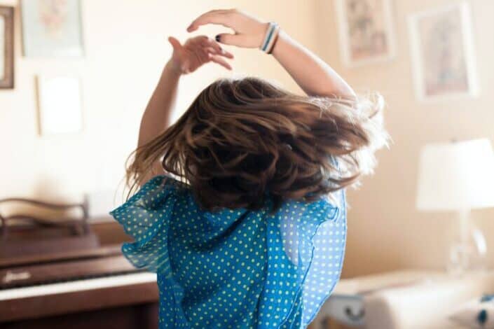a girl dancing in the room