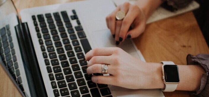 Woman typing on a laptop