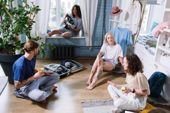 A group of people hanging out in a room