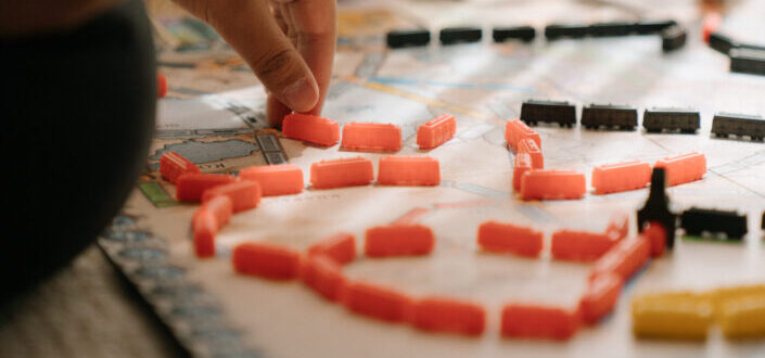Hand setting up domino-like structure