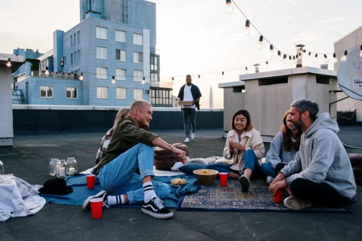 A group of friends talking on the rooftop