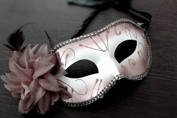 Carnival mask decorated with pink flower