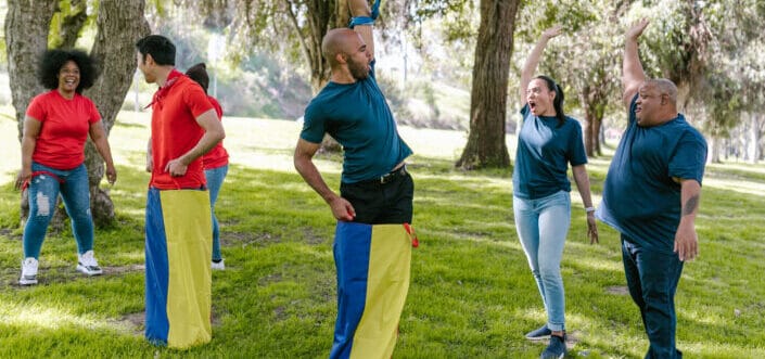 Group of adult people playing outdoor