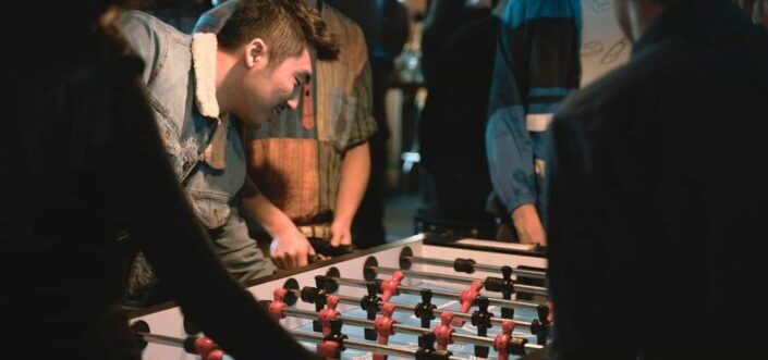 Friends enjoying football table