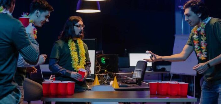 Friends playing beer pong