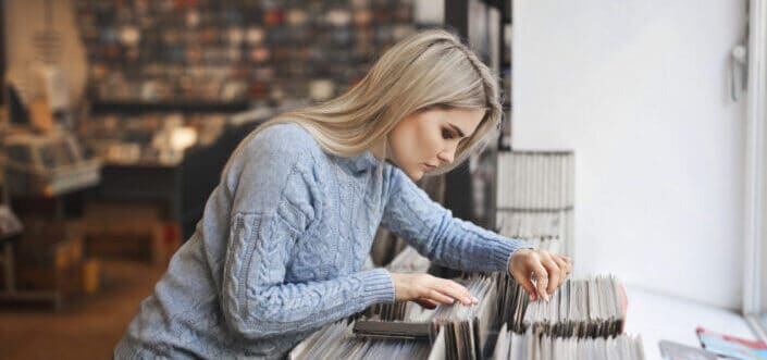Woman searching document the pile of records.
