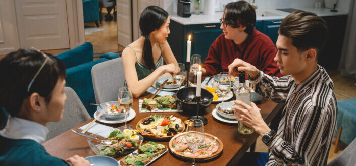 Young adults having meal together