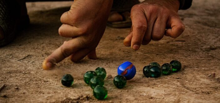 Marbles lines up in the ground