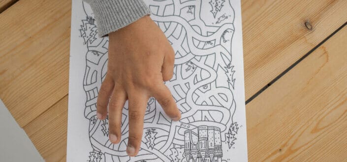 Kid solving a maze 