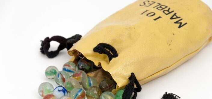 A bunch of marbles placed in a bag