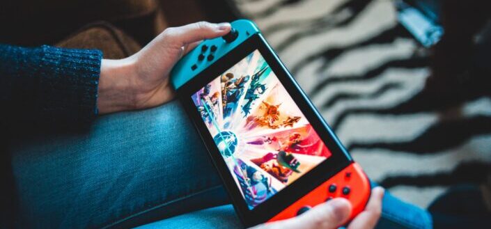 A guy playing with a Nintendo