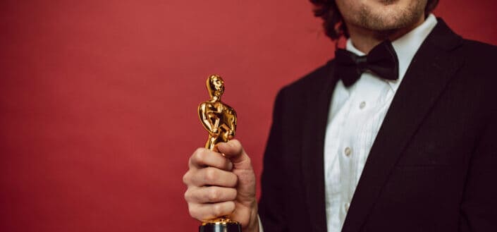 An Actor Holding His Award