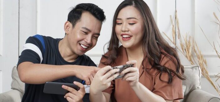 couple playing together and competing in video games