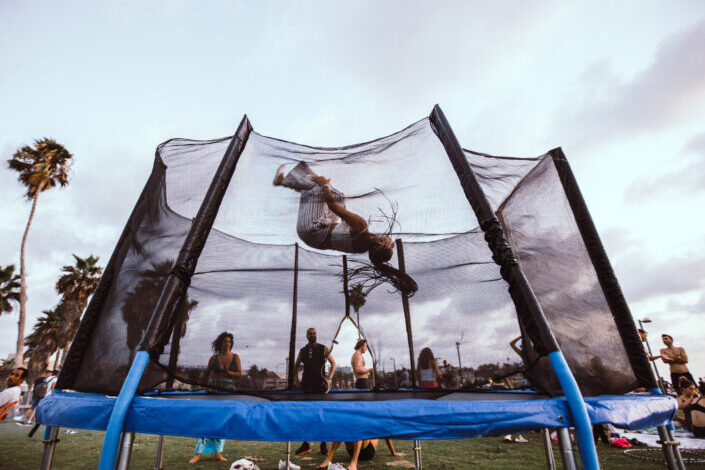 jumper doing somersault on trampoline