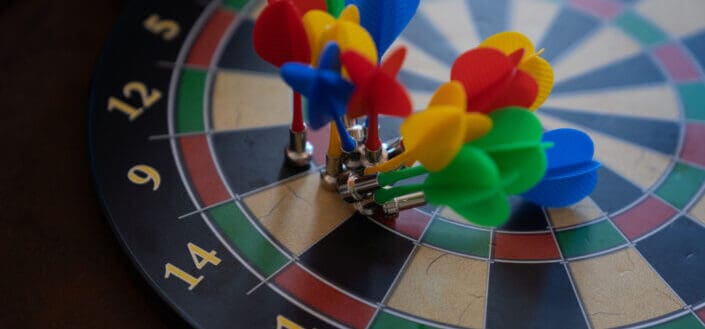 Magnetic darts on dartboard