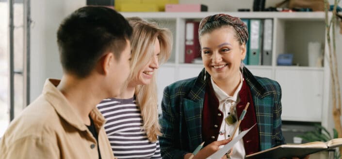 Workmates Discussing Work at the Office
