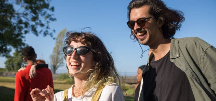 Man and Woman Happily Basking in Sunlight