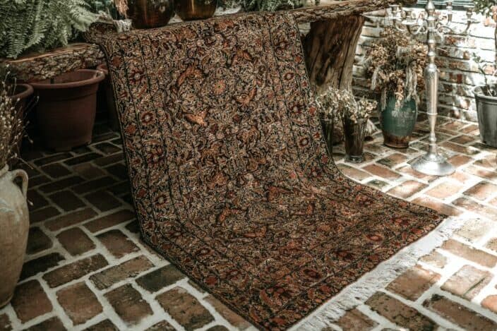 Brown Carpet Hanging on the Garden