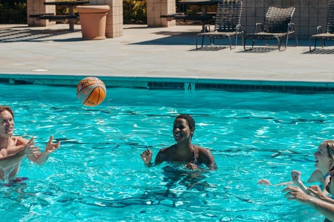 people playing basketball in swimming pool - Swimming Pool Games
