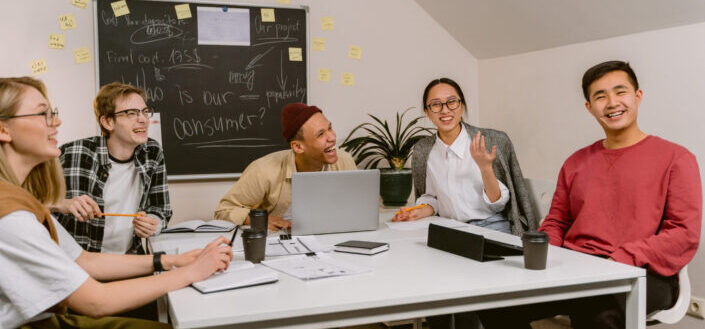 Officemates Laughing While in a Meeting