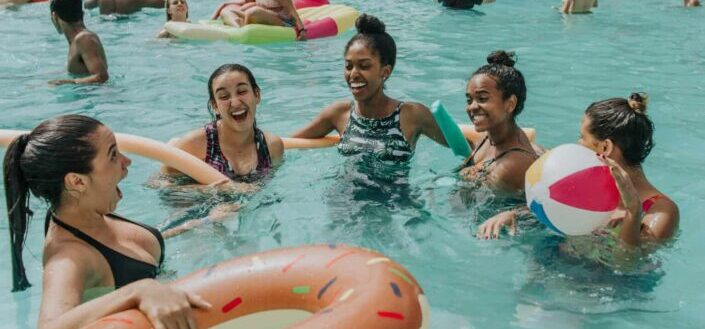 Friends having fun together in swimming pool