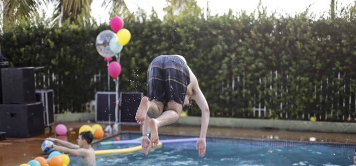 Man jumping into the pool