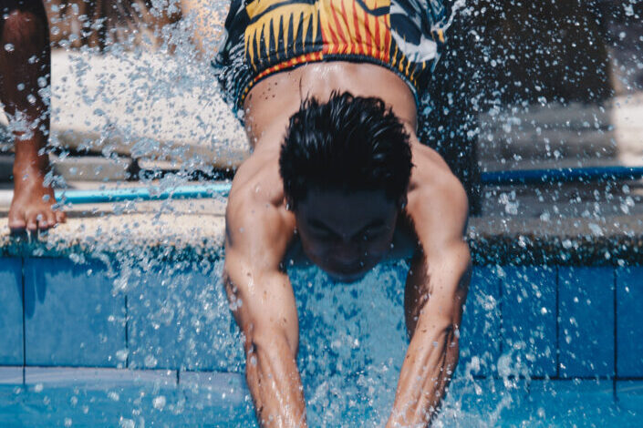 Man diving into pool
