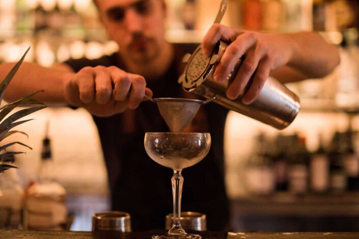 Barmen Making Drink at Counter