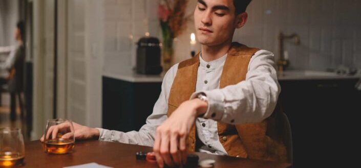 Man Playing Cards on The Table